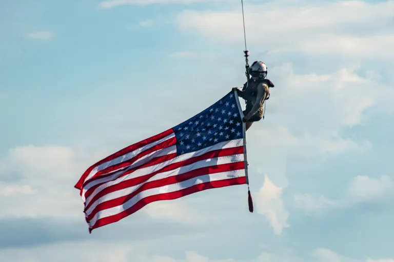 American military displaying American flag prior to upgrading oth discharge