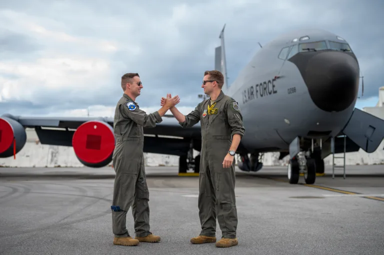 Board of Inquiry Attorneys in front of Military Aircraft