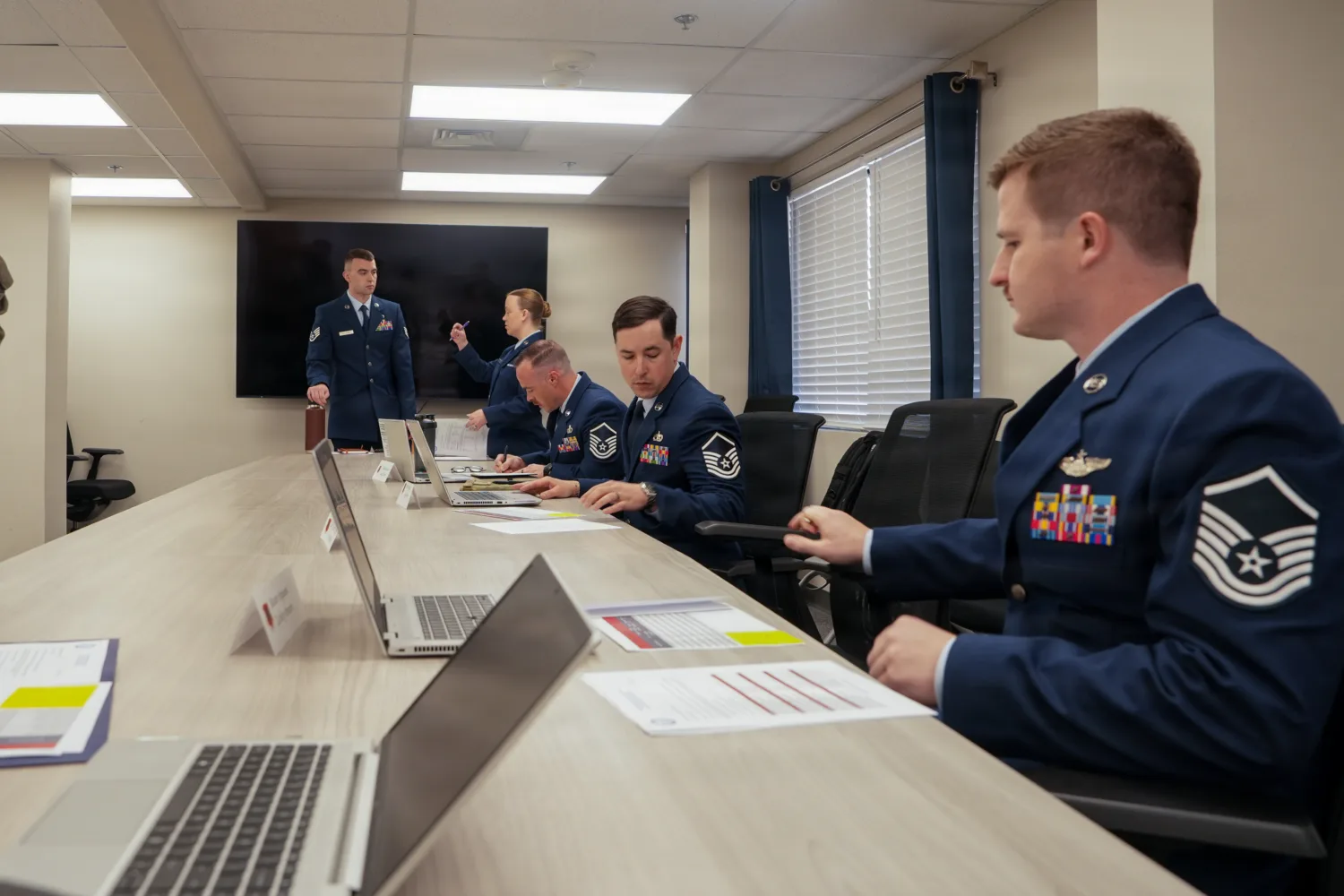 Airmen writing administrative separation board rebuttal while in uniform