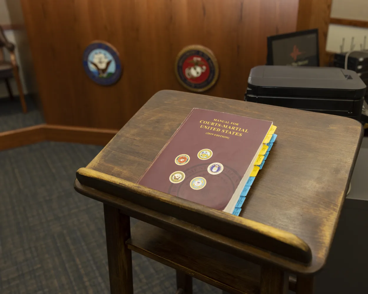 Manual for Court Martial and a retirement in lieu of elimination podium